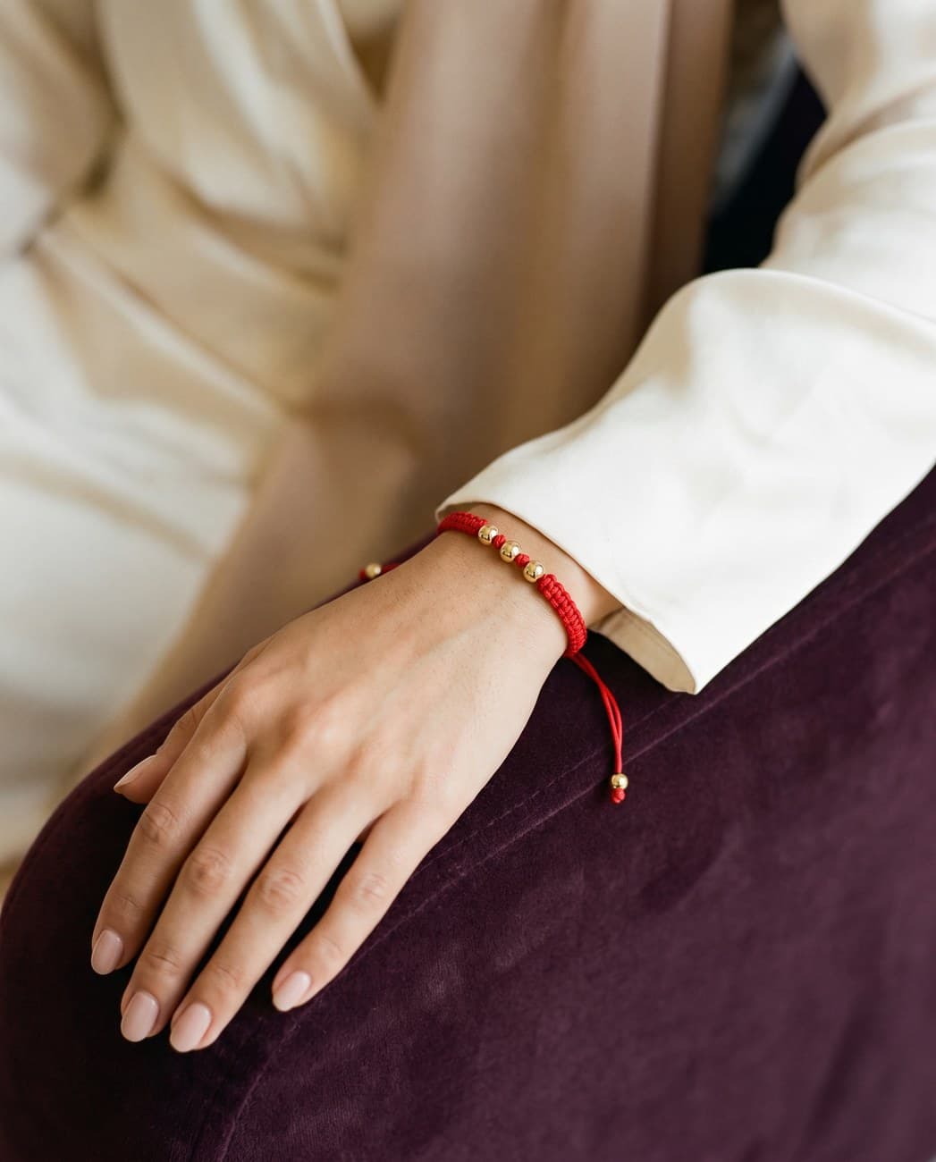 Israa · campaign photograph, worn