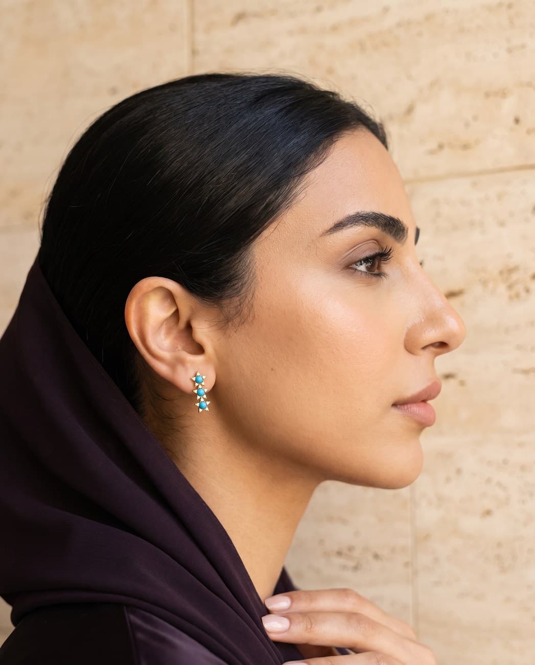 Nuqta · campaign photograph, worn